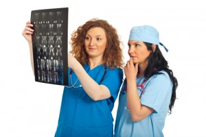 http://www.dreamstime.com/stock-photos-radiologists-women-examine-mri-image19590493